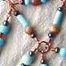 enameled copper pendant with glass bead accents